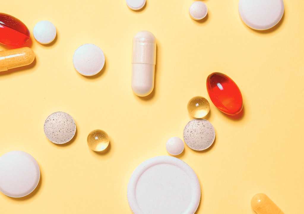 Pills on a yellow background.