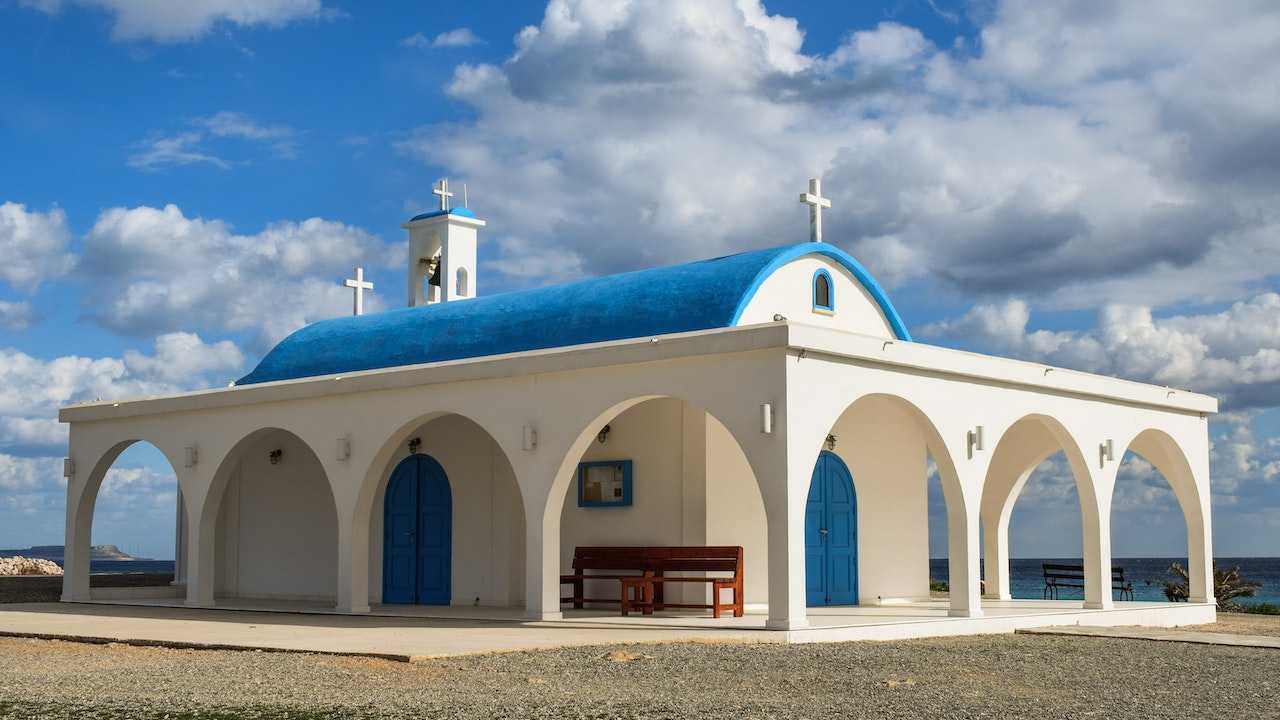 A small church in the southern hemisphere under a blue sky.